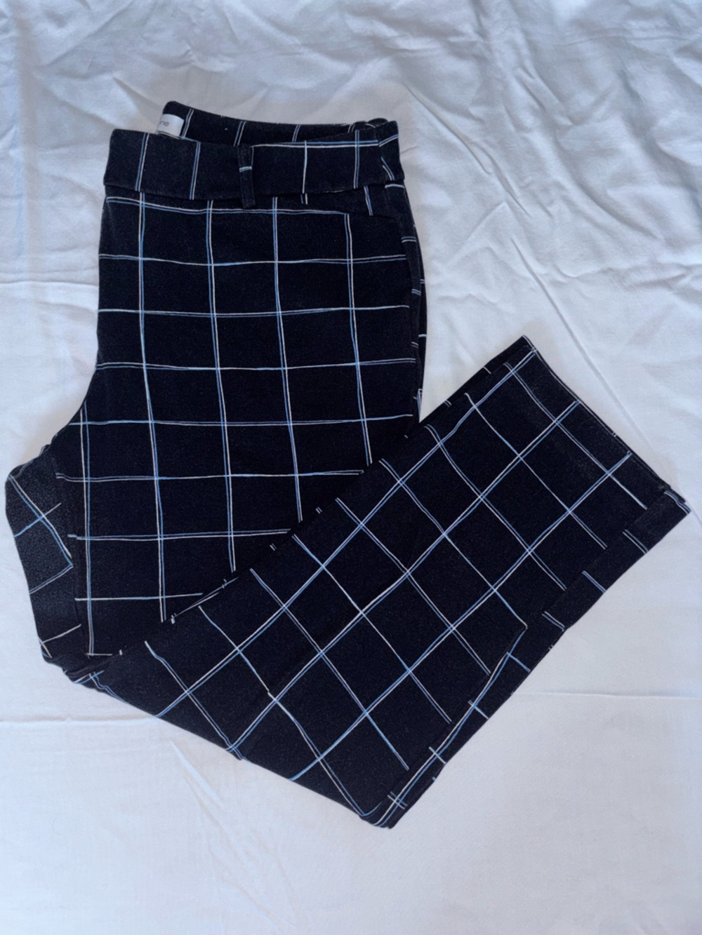Black pants with white and blue stripes